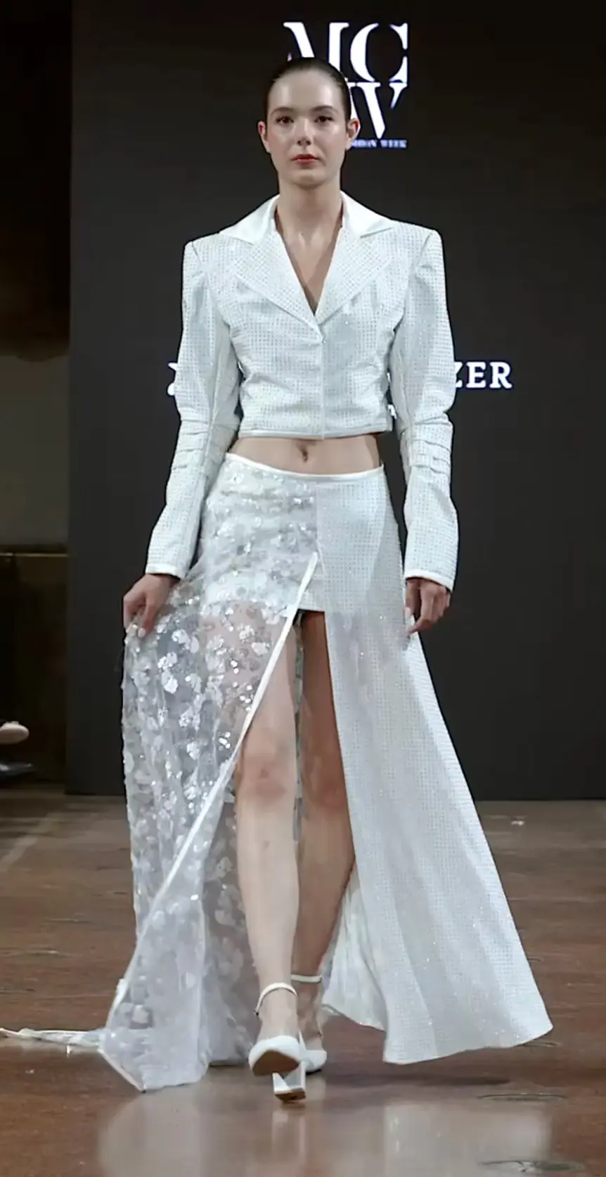 Angels Never Die collection runway look in white tailored outfit
